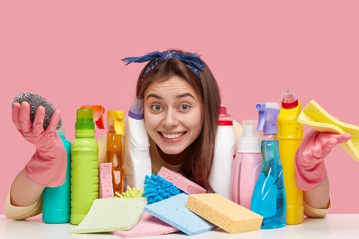 pleased-lady-with-european-appearance-toothy-smile-wears-headband-looks-positively-through-detergents_273609-24241